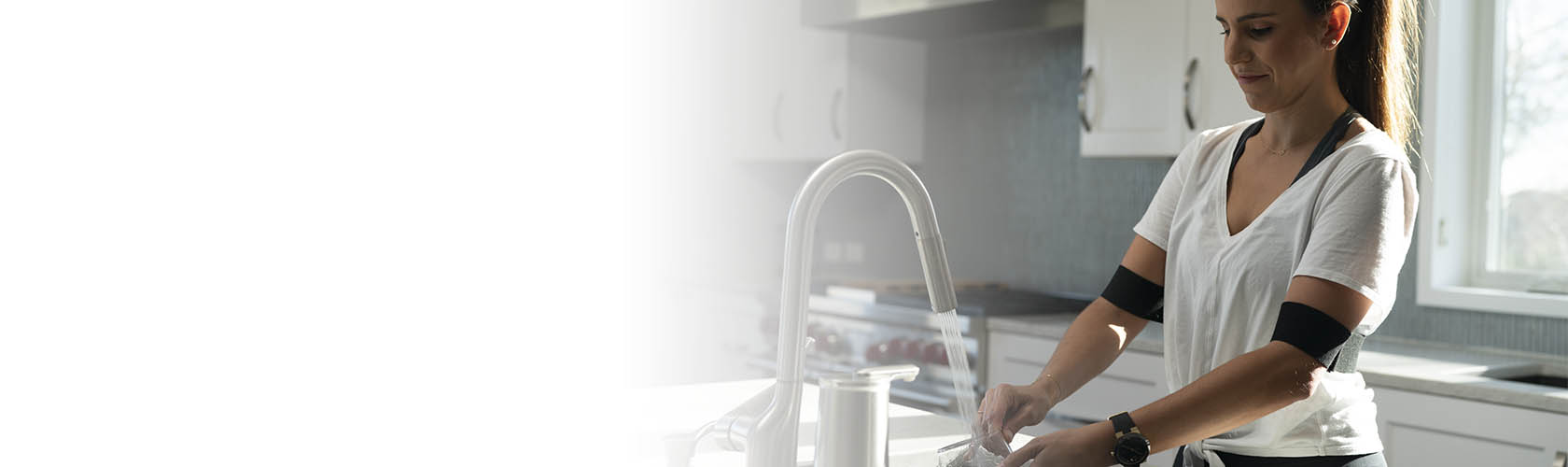woman wearing she rex and washing dishes